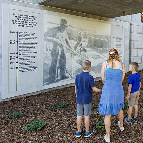 under a bridge people looking at CALA developed conceptual designs, bridge aesthetics, construction documents, visual simulations, public outreach, monumentation, historic interpretation, and placemaking for the three bridges, urban plaza space and trail connections