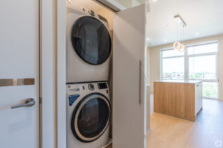 Stacked washer and dryer in modern kitchen