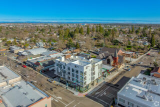 Aerial view of downtown with streets and buildings.